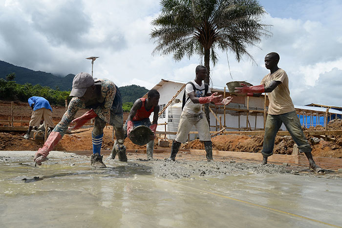 Local builders working on the construction of a new UK Ebola Treatment Unit in Kerry Town in Sierra Leone.