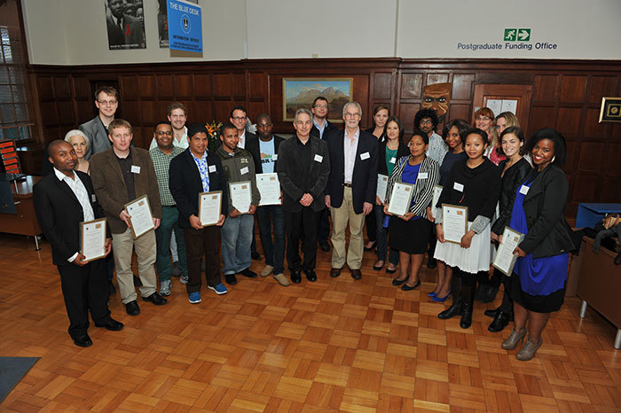 Vice-Chancellor Dr Max Price and Deputy Vice-Chancellor Prof Danie Visser (middle) congratulate the postgraduate students and their supervisors who received Research Associateship Awards.