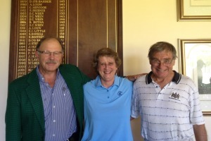 Winner of the annual Ron's Mug Golf Competition, Prof Flip Bornman (left), dons the "vile green jacket". He is flanked by Kate Brown, the winner of Kate's Jug, the competition for UCT staff members' spouses, and Prof Alan Pontin, the Ron's Mug champion of 2013.