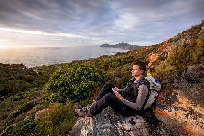 Free from the sea: PhD researcher Matthew Lewis observes the Kanonkop baboon troop foraging for seafood at the Cape Point Nature Reserve. Lewis was one of 86 UCT doctoral students who graduated in June 2015. His supervisor was Prof Justin O'Riain in the Department of Biological Sciences.