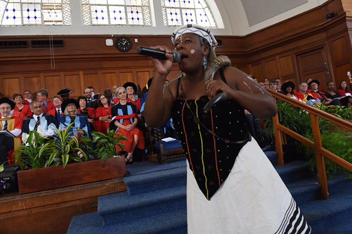 The imbongi at Saturday morning's graduation raining praise on the university's graduands. Sange is a third-year African music student at UCT.
