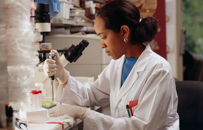 There's a long road to parity for women in science in southern Africa. (Photo courtesy of NIH National Cancer Institute, accessed via <a href="https://commons.wikimedia.org/wiki/File:Researcher_uses_pipettes.jpg" target="_blank">Wikimedia Commons.</a>)</i>