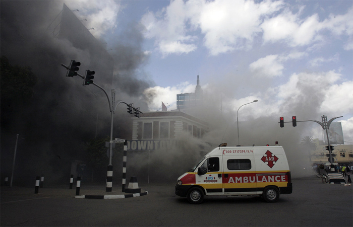 An ambulance arrives to evacuate casualties from a fire at the Nakumatt supermarket in Kenya. Reuters/Antony Njuguna.