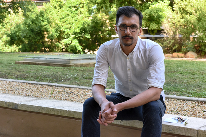 Curator of the Decolonial Alternatives Project Space, Sadiq Toffa, pictured at the Rustenburg Burial Ground located on UCT's middle campus.