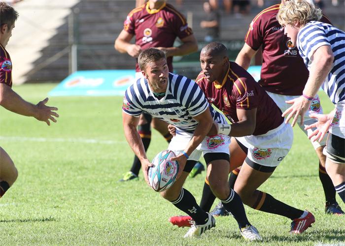 Scrumhalf Nic Groom, here about to offload in the tackle against Maties in 2014, is one of several former UCT rugby players that have been called up to their national squads for the upcoming round of Test series.