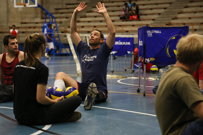 Raimondo demonstrates how to set a shot while keeping your pelvis rooted, as per the rules. Sitting volleyball debuted at the Toronto Paralympic Games as a demonstration sport for amputees and has been played as a medal sport since.