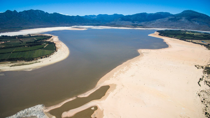 Extremely low levels of water currently in the Theewaterskloof Dam, the largest dam serving the City of Cape Town.