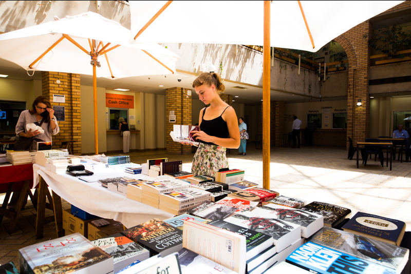 Attendees browse books for sale during Summer School.