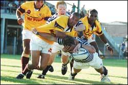 Crossing the line: Ashley Down (ball in hand), with Tyrone McFarlane lending support, goes over for one of UCT's six tries against Tygerberg.