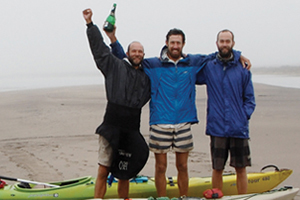 Source to sea: (From left) UCT's James Puttick, Sam Jack and Ian Durbach celebrate at the Orange River mouth, Atlantic Ocean, having completed their Senqu2Sea expedition, the first full-length ecological census of the river's vegetation and ecosystems. (Photo by Peter Jack.)