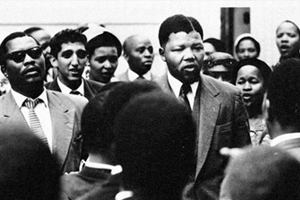 By representing himself and using the Rivonia Trial as a "showcase for the ANC's moral opposition to racism" Nelson Mandela used an apartheid court of law as a channel for a political protest, fundamentally changing the relationship between law and politics in South Africa, says Carrol Clarkson. This image of Mandela is from the days of the Treason Trial in 1956. ©Photograph by JÃ¼rgen Schadeberg. Sourced from the University of Cape Town Libraries Special Collections.