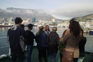 A UCT Oceanography PhD student guiding winter school students around the Agulhas II.