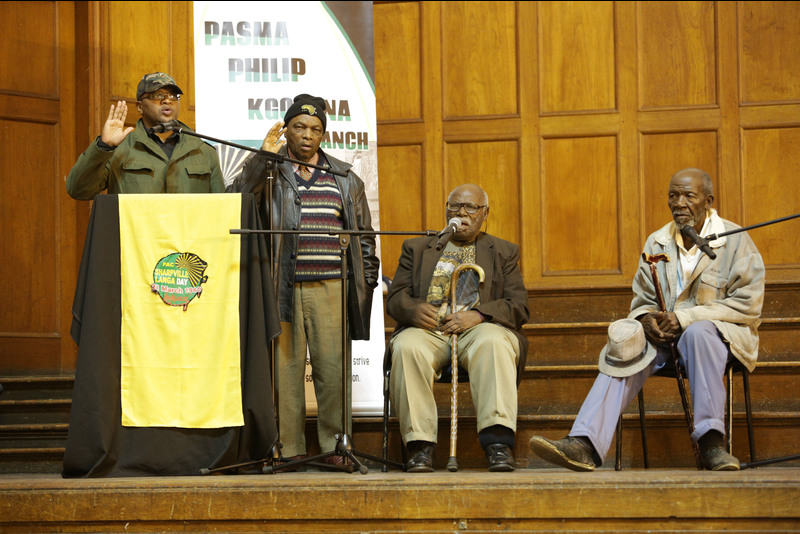 PAC Western Cape provincial leader Kenny Bafo, at the lectern, and PAC stalwarts paid tribute to Philip Kgosana at UCT on 26 April.