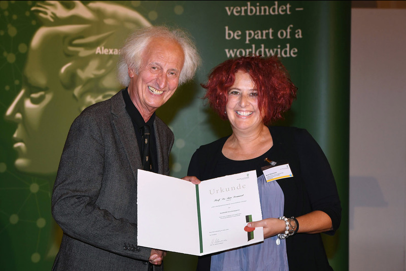 Sociolinguist Prof Ana Deumert receives the laudation for her Humboldt Research Award from Professor Helmut Schwarz, president of the Alexander von Humboldt Foundation, in Berlin.