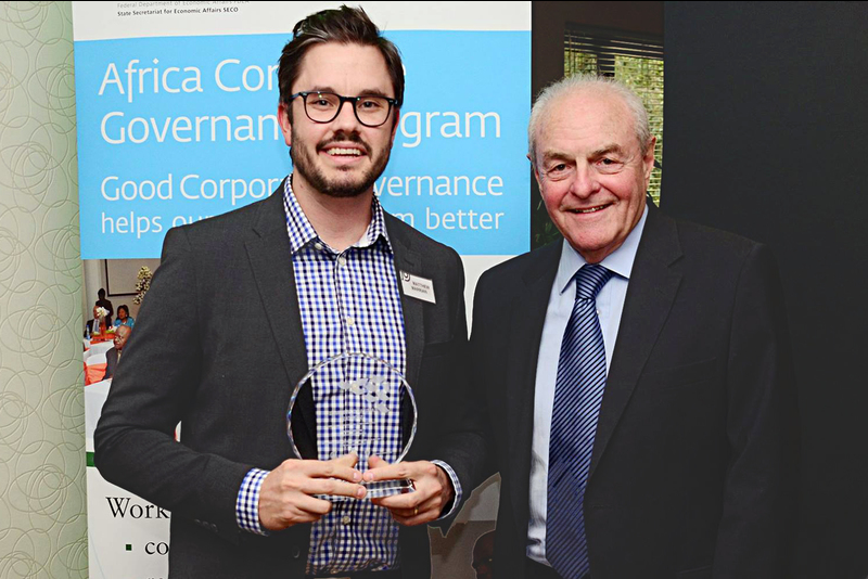 MBA student Matthew Marrian, with Mervyn King, accepting the annual African Governance Showcase Competition award for an African business case study he produced with Assoc Prof Stephanie Giamporcaro.