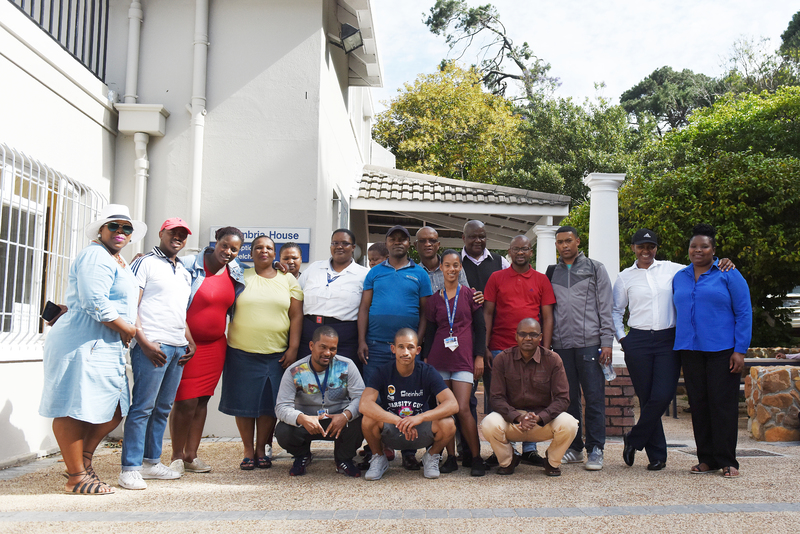 Members of Properties and Services outside Cambria House where they are tackling after-hours matric and basic adult education and training pilot programmes.