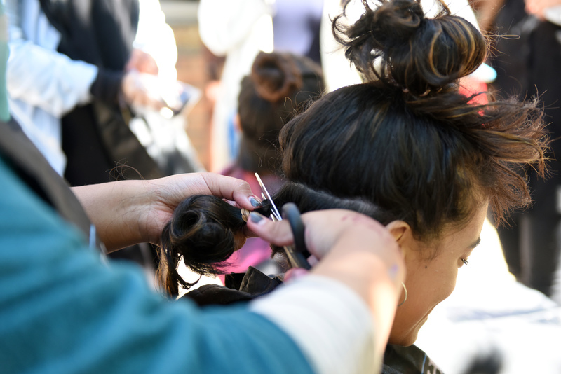 A participant opts to donate a ponytail at the 2017 CANSA Shavathon. Donations of human hair are used to fashion wigs, provided free of charge, for cancer patients experiencing hair loss.