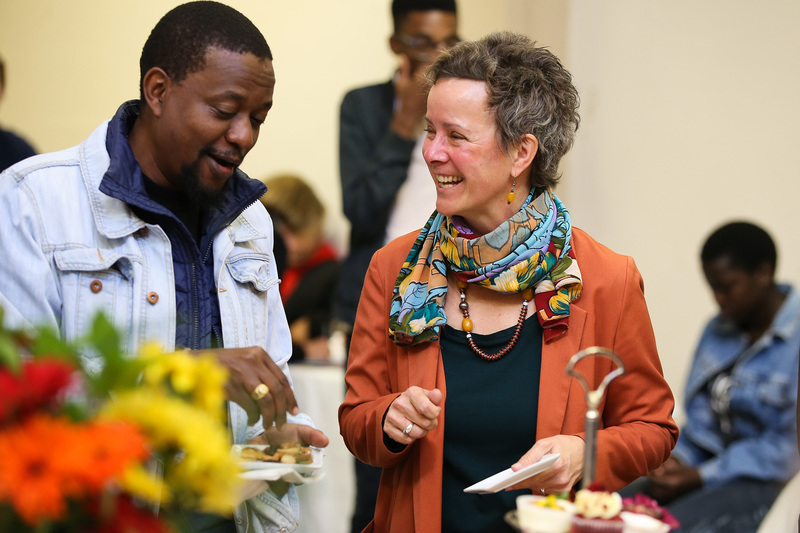 Assoc Prof Suellen Shay, who is stepping down as CHED dean, shares a laugh at her farewell tea with Daniel Munene, head of department of the Education Development Unit (EDU).