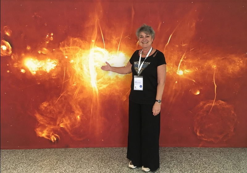 UCT Chair of Astronomy Prof Renee Kraan-Korteweg photographed in Vienna at the General Assembly of the International Astronomical Union the day after the SAWISA event. The MeerKAT image behind her was released at the MeerKAT launch, and featured at the MeerKAT exhibition booth in Vienna.