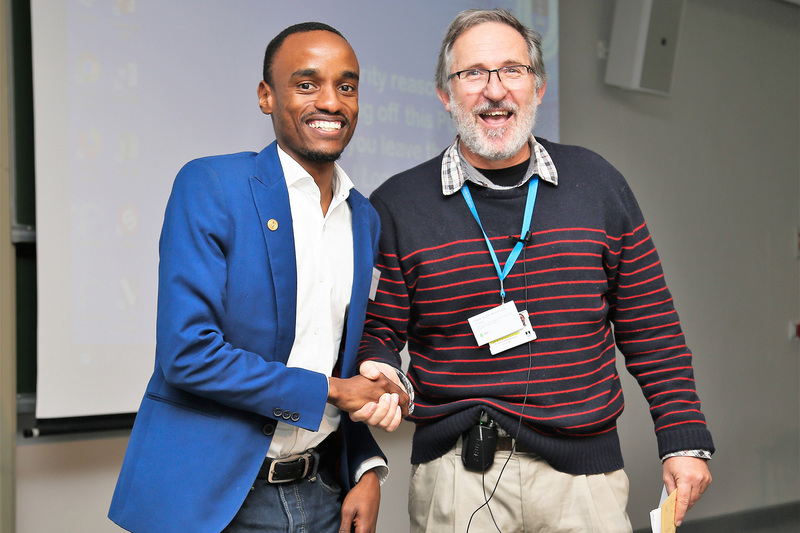 Science category and People’s Choice winner Rene Nsanzubuhoro, assistant lecturer in the department of Civil Engineering (left), is congratulated by Professor Peter Meissner, director of the Office of Postgraduate Studies and chair of the event