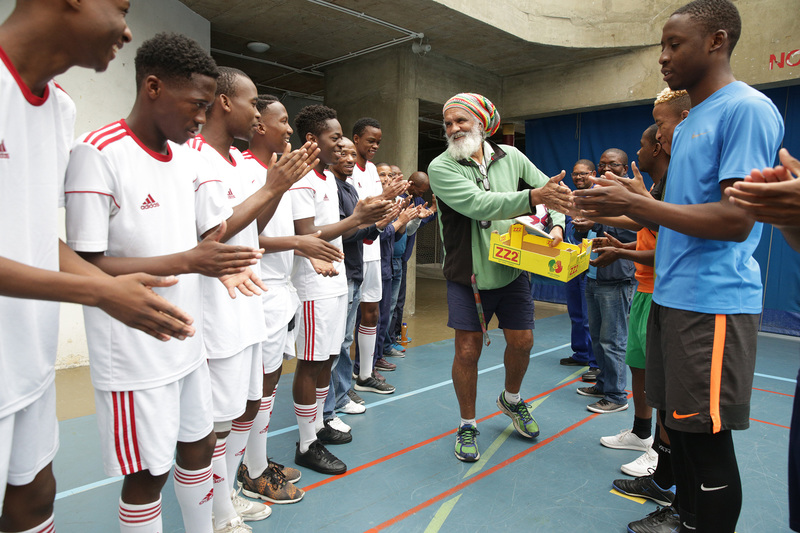 Players formed a guard of honour to welcome Peter Buckton to the final game he refereed at UCT last week.