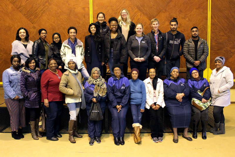 Nabeelah Gani (fifth from left, second row) and Josh Fieggen (third from right, second row) join their fellow fourth-year medical students and community members who attended the first-aid workshop for a commemorative picture. Christolene Beauzac-McKay, UCT’s site facilitator in Mitchell’s Plain, is second from left, second row.