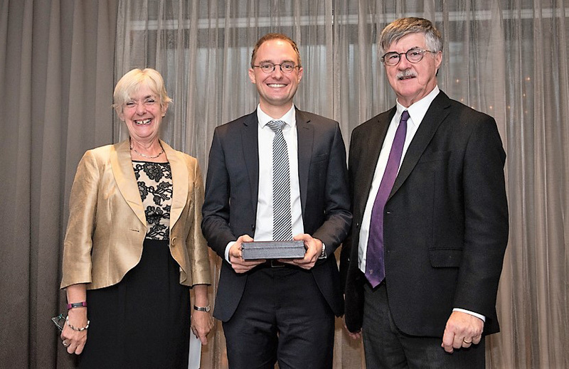 Dr Charle Viljoen (centre), a clinical research fellow in the Division of Cardiology, receives his award from Dr Sally Davies, co-chair of the Royal College International Awards Subcommittee, and Dr Andrew Padmos, chief executive of the Royal College of Physicians and Surgeons of Canada.