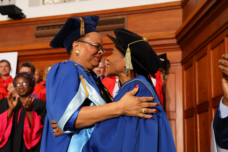 Chancellor Graça Machel shares a special moment with VC Mamokgethi Phakeng after officially investing Phakeng with her robe of office.