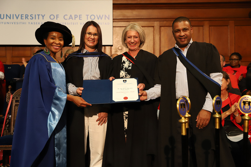 SATVI representatives (from second from left) field site manager Marwou de Kock, senior research officer Dr Michèle Tameris and Kelvin Vollenhoven, communications and marketing manager, collect the Social Responsiveness Award from VC Prof Mamokgethi Phakeng (left) at the Faculty of Health Sciences graduation ceremony on Saturday, 13 April. <b>Photo</b>&nbsp;Michael Hammond.
