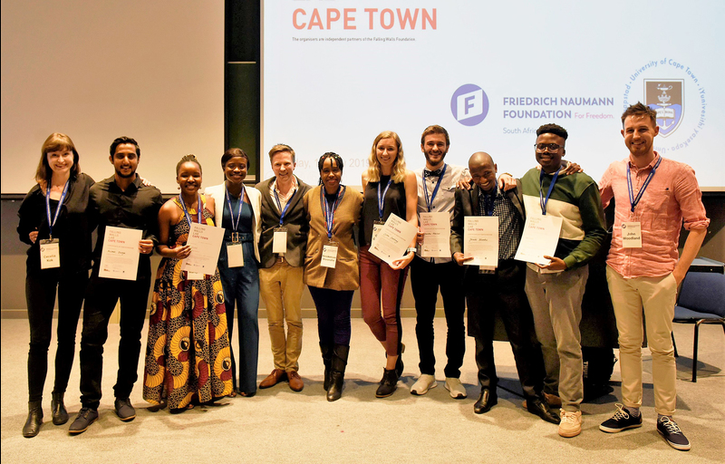 Winner of the Falling Walls Lab in Cape Town Hlumelo Marepula (third from left), who will compete against 99 other global finalists in Berlin. Also in picture are (from left) Cecelia Kok (Friedrich-Naumann Foundation), Avishek Dusoye, Sylvia Dorbor, Dyllon Randall (senior lecturer, Department of Civil Engineering), Resoketswe Manenzhe (2nd place winner), Caitlin Courtney, Denislav Marinov, Sikozile Ncembu, Vukheta Mukhari (3rd place winner) and John Woodland (postdoctoral research fellow, Department of Chemistry).