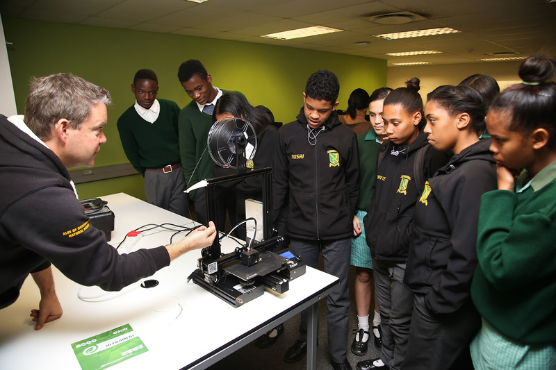 Ocean View Secondary School learners watch enthralled as a 3D print design becomes reality during their visit to UCT, organised in a bid to spark their interest in a career in computer science.