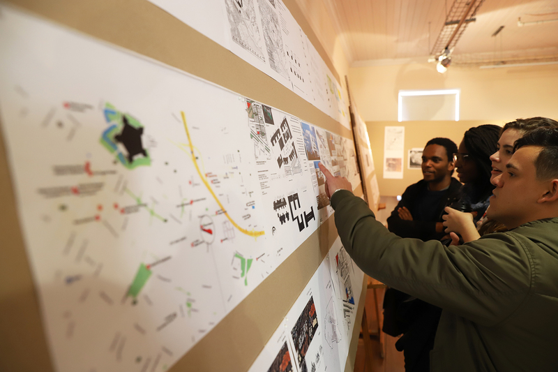 Students study the pop-up exhibition of past architecture honours students’ work that was displayed at the District Six Museum Homecoming Centre. 