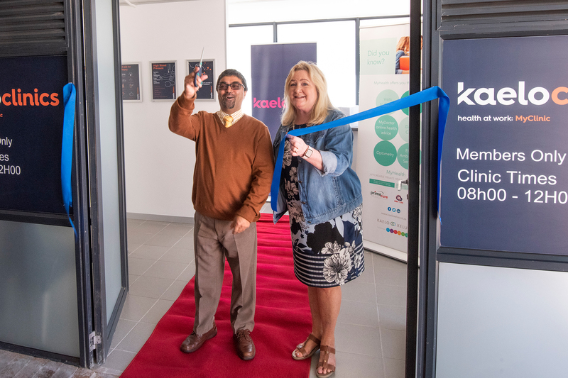 UCT COO Dr Reno Morar cuts the ribbon to officially open the KaeloClinic to all staff who are on the Kaelo Primary Health Care product.