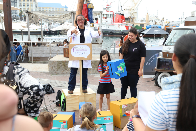 Dr Natasha Karenyi, from UCT’s Department of Biological Sciences, keeps the crowds entertained during SA’s first Soapbox Science event at the V&A Waterfront.