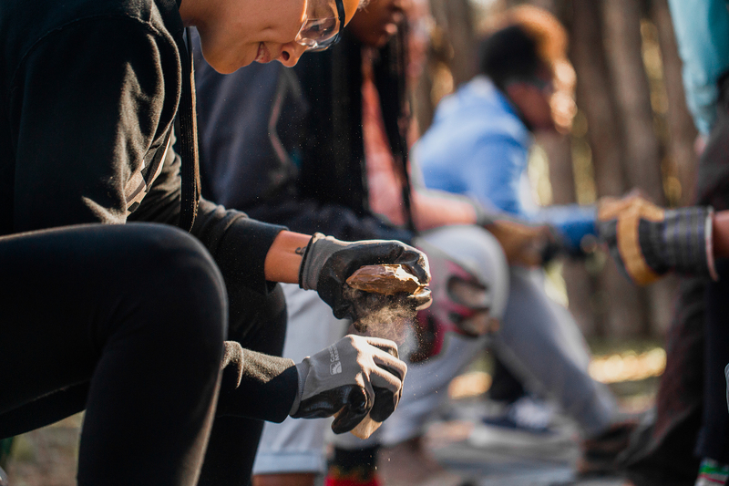 UCT students learn flintknapping skills at a Human Evolution Research Institute field camp for women. The science faculty’s new code of conduct was workshopped at the camp.