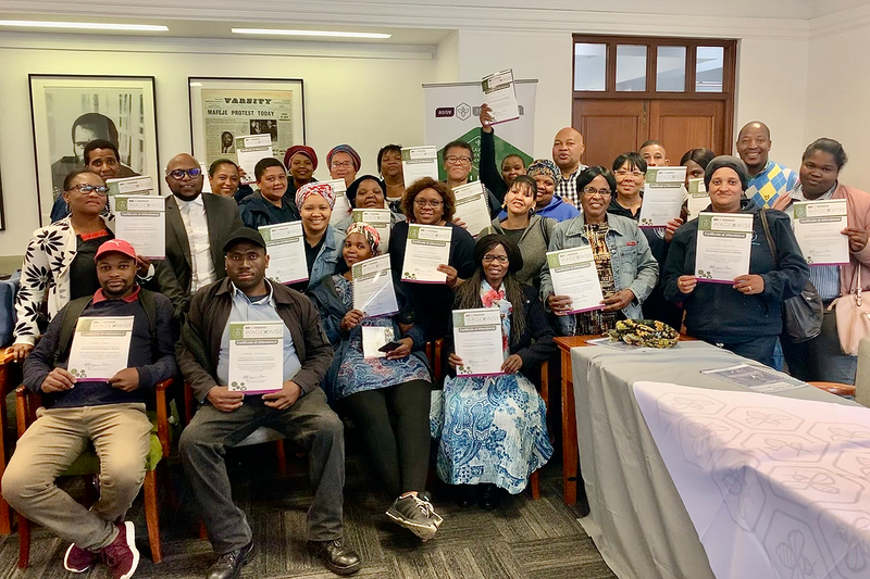 UCT staff proudly display their certificates after attending the latest financial literacy training session.