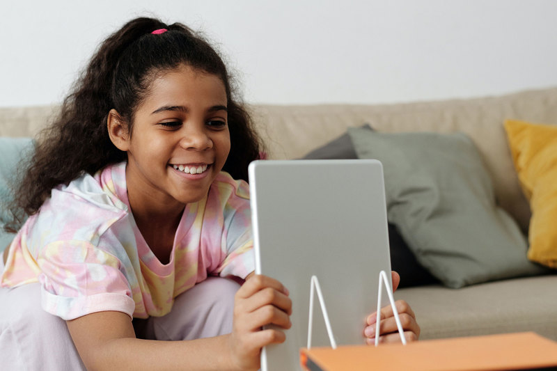 &ldquo;Oaky and the Virus&rdquo; is free to download and suitable for children nine years old and younger. <b>Photo</b> <a href="https://www.pexels.com/photo/photo-of-girl-smiling-while-holding-tablet-computer-4144103/" target="_blank">Pexels</a>.