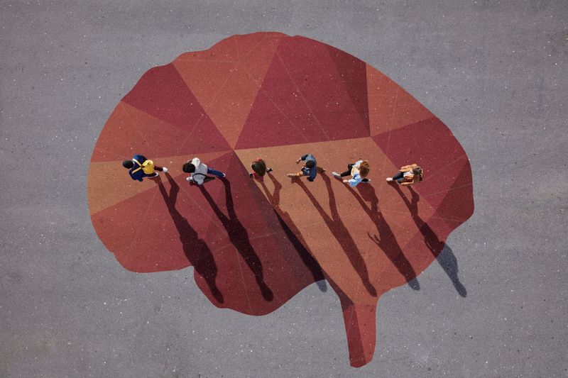 Four UCT students are Reimagine Challenge 2020 winners. <strong>Photo</strong> <a href="https://www.gettyimages.com/detail/photo/people-walking-in-line-across-painted-brain-on-royalty-free-image/912014996" target="_blank">Getty Images</a>.