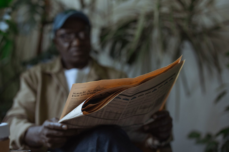 Research on South African media&rsquo;s coverage of the COVID-19 pandemic has shown little reflection on the experiences of ordinary people; and little provision of health information that could increase citizens&rsquo; self-efficacy. <strong>Photo</strong> <a href="https://www.pexels.com/photo/low-angle-photo-of-man-reading-newspaper-7870687/" target="_blank">Ron Lach / Pexels</a>.
