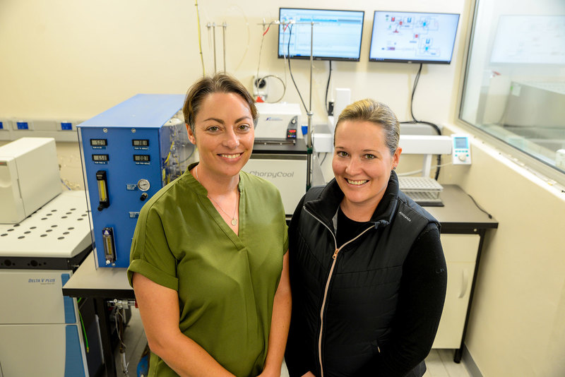 Principal investigators Dr Katye Altieri (left) and Dr Sarah Fawcett with the new dentrifier-isotope ratio mass spectrometer (IRMS), housed in the recently built biogeochemistry laboratory in the Department of Oceanography. 