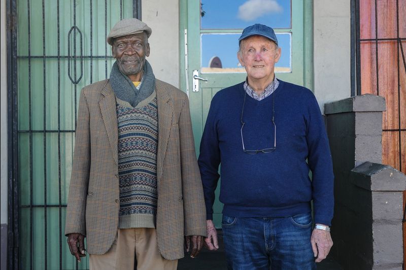UCT veteran architect Emer Prof Julian Cooke (right) with Clarence Mahamba, one of the first leaders of the Hostel Dwellers Association, which played a key role in efforts to improve the inhuman hostels in KwaLanga, Nyanga and Gugulethu.