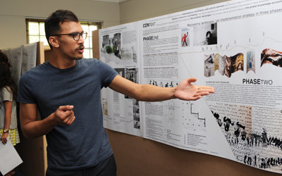 Sadiq Toffa, winner of the design competition to commemorate the slaves buried at the Rustenburg farm – now UCT’s middle campus – explains the different phases of his winning proposal. <b>Photo</b>&nbsp;Michael Hammond.