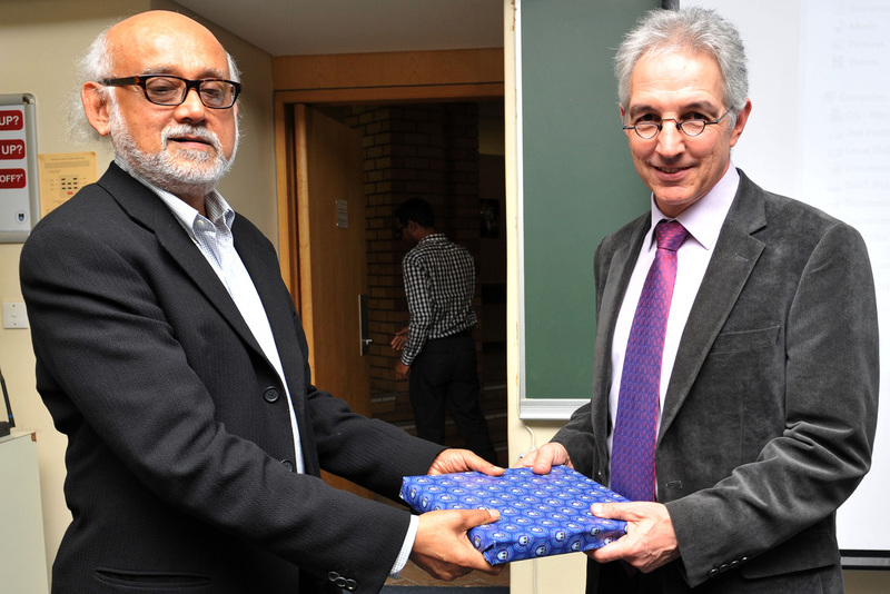 Prof Partha Chatterjee from Columbia University accepts a gift from UCT Vice-Chancellor Dr Max Price after delivering a VC&nbsp;Open Lecture centred on colonialism and the power it still exerts on modern states.
