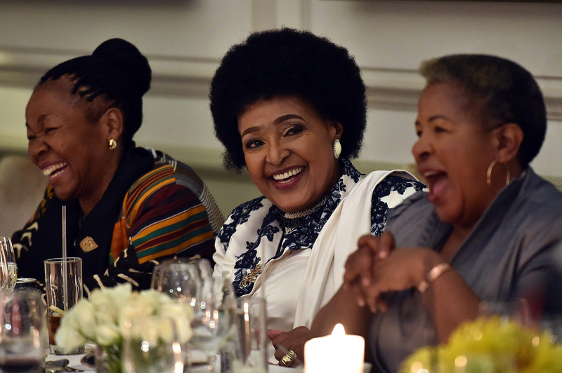 Winnie Madikizela-Mandela shares a light moment at her 80th birthday celebrations held at Mount Nelson Hotel in Cape Town. (Photo: GCIS)