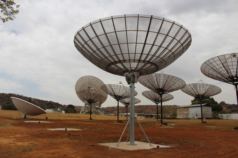 The 10-dish HIRAX telescope prototype array recently installed at a test site near Johannesburg. The final HIRAX telescope will allow scientists to research the early universe. 