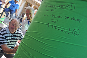 Dugald Macdonald and Prof Mike Meadows pen their messages of good luck on the 'Green Mile'