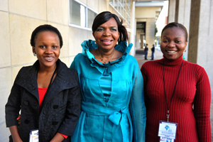 Maletsabisa Molapo (left) and Joyce Mwangama (right) celebrated their scholarship coup with Minister of Communications Dina Pule