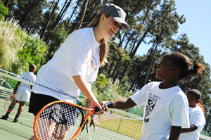Lindokuhle Gwele of St. Mary's Primary with coach Jessica Ellis 
