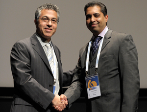 Assoc Prof Keertan Dheda (right) is congratulated on his IUATLD award by Dr Michael Kimerling
