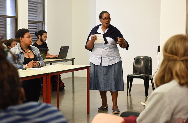 Nozizwe Beya of Nehawu and SuperCare speaks at a 19 March public meeting of students, staff members and outsourced workers to discuss transformation at the university, . Photo by Michael Hammond.